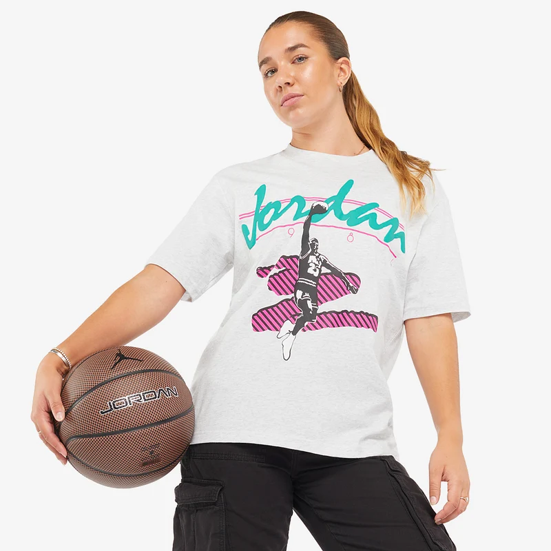 Basketball jerseys on a merchandise rack.